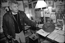 Curator Bill Pollak stands in one of the School Museum’s exhibit rooms.