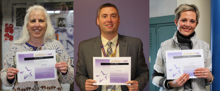 Three recipients of ABCD award holding certificates