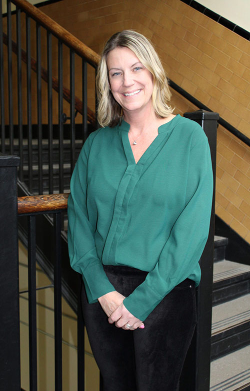 Karyn Watson poses in a stairwell