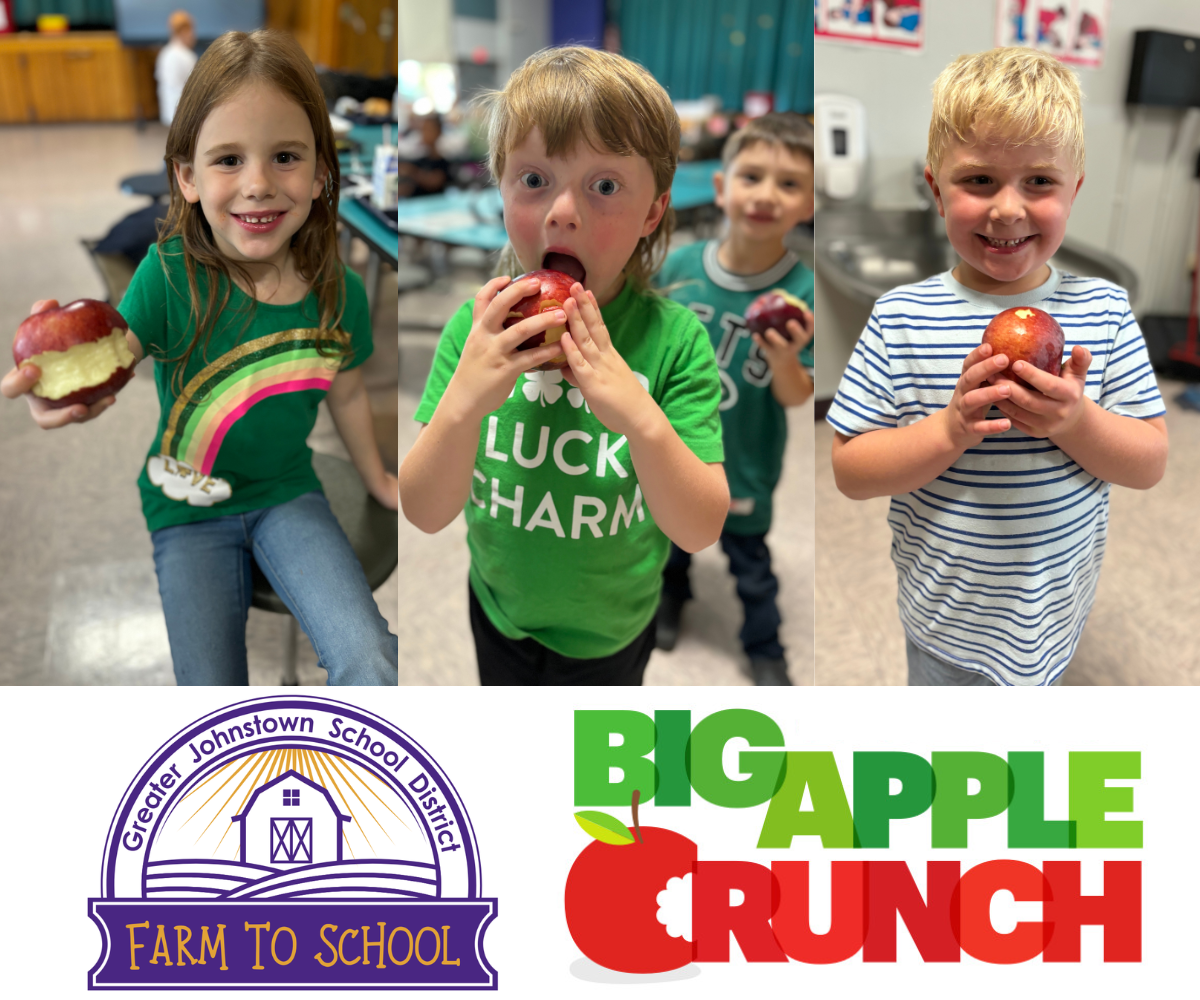 three young students show off an apple that they are eating, with two logos underneath them - one for "Farm to School" and one for "Big Apple Crunch"